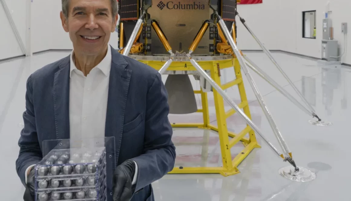 Jeff Koons ahead of the launch of Intuitive Machines’s lunar module, holding his artwork destined for the moon, Jeff Koons: Moon Phases (Image credit: Copyright, Jeff Koons)