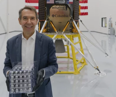 Jeff Koons ahead of the launch of Intuitive Machines’s lunar module, holding his artwork destined for the moon, Jeff Koons: Moon Phases (Image credit: Copyright, Jeff Koons)